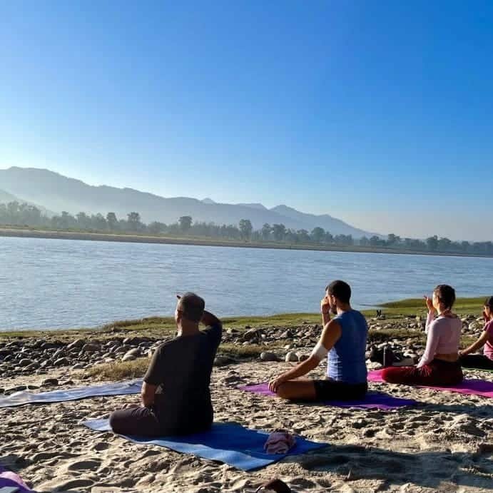 Riverside yoga class in